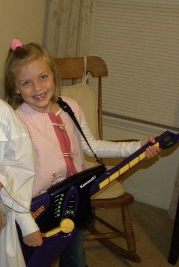 Young Natalie Renee with guitar 